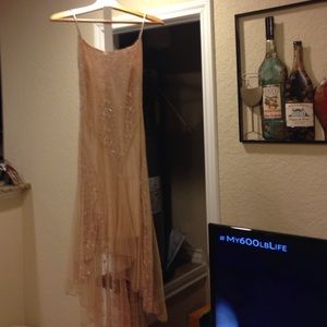 Tan dress accented with sparkle accents