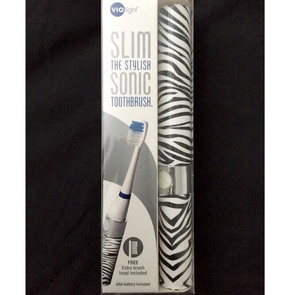 BRAND NEW • Zebra Print Electronic Toothbrush