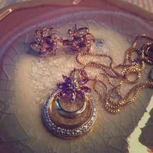 Gold necklace with purple and white stones