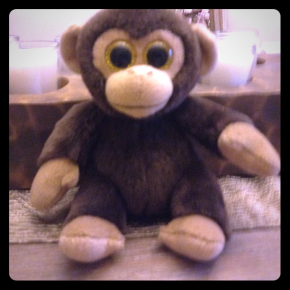 Brown and it's a monkey