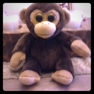 Brown and it's a monkey