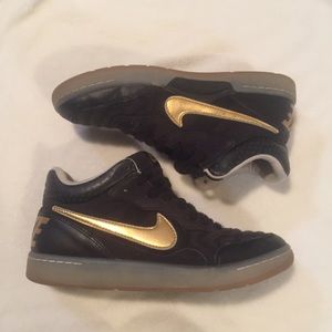 Black and gold Nike