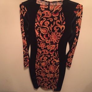 Long-sleeve orange and black bodycon dress