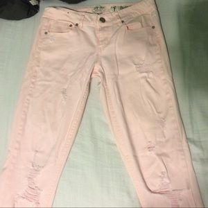 Light pink destroyed jeans