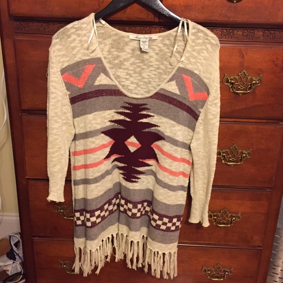Patterned sweater with fringe