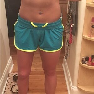Teal and yellow Nike shorts.