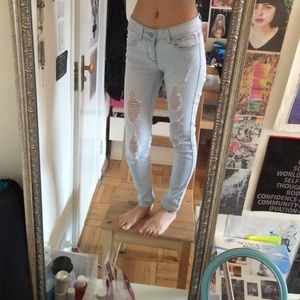 Light wash distressed skinny jeans