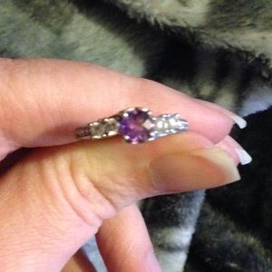 Amethyst ring. I believe it's sterling silver.