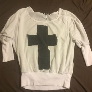 White sweater with black cross. Lightly used.