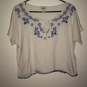 Beige top with blue accents