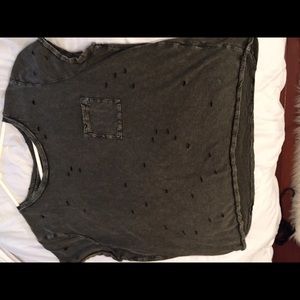 Shirt with pockets and holes