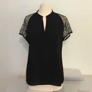 Black top with black net and silver flower lace.
