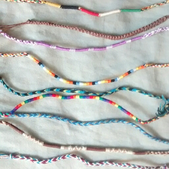 11 friendship bracelets or anklets