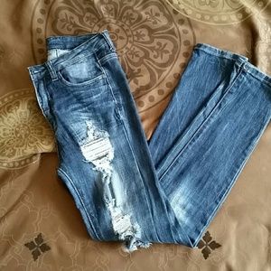 Distressed ripped high waisted dark blue jeans