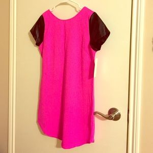 Neon pink with black leather sleeves dress