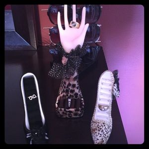 Ring holders. Two high heel and one arm and hand!