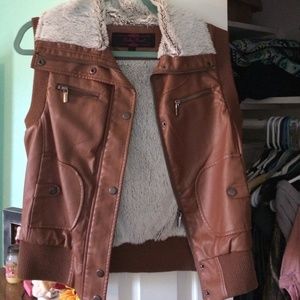 Shop Kiki Larue Faux fur/leather vest.