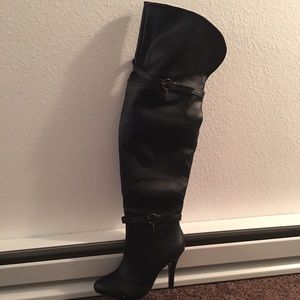 Black pointy high though heeled boots