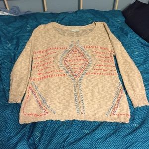 Blue, Pink, and Cream sweater.