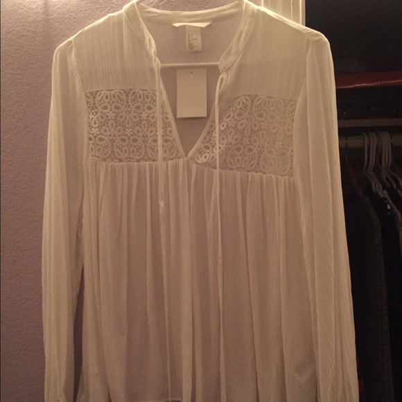 H&M, all white flowy shirt.