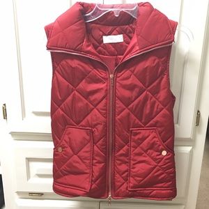 Red quilted vest with copper tone zipper/buttons