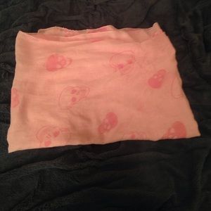 Light pink scarf with skulls.