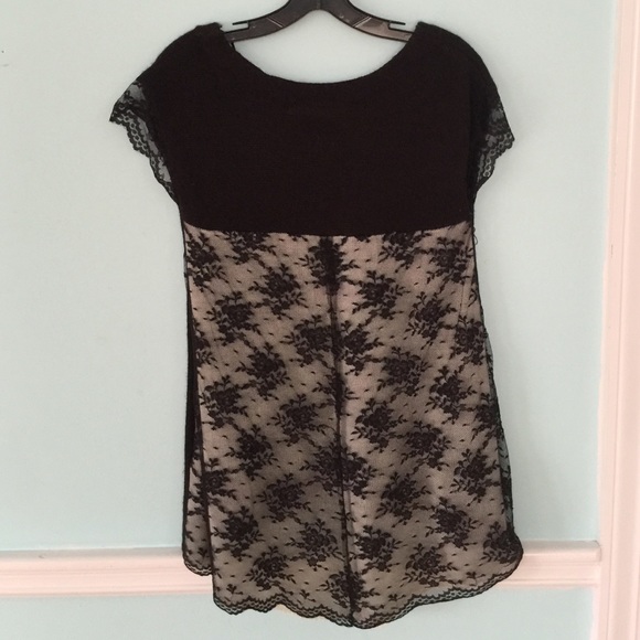Black top with lace on the back and cap sleeve