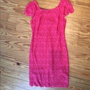 Scalloped edges, coral colored dress