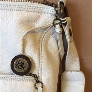 Sak cross body bag. Picture of person with bag.