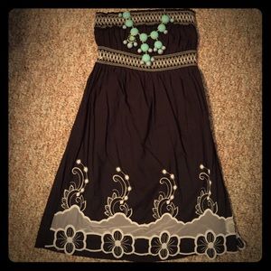 Strapless black dress with embroidered detail