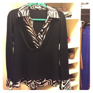 Awesome top! I think it fits more like a medium