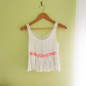 White top with neon pink detail