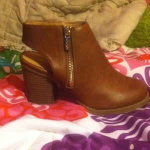 Heeled booties with cut out heel