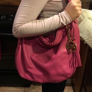 Michael Kors fuchsia hobo bag.