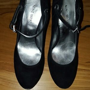 Black closed-toe pumps with straps across