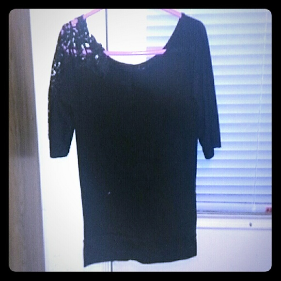 Long sleeve shirt with lace on one sleeve