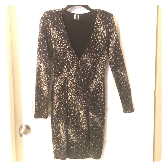 Form fitting deep V neck dress