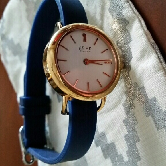 Keep collective watch and navy wrist band.