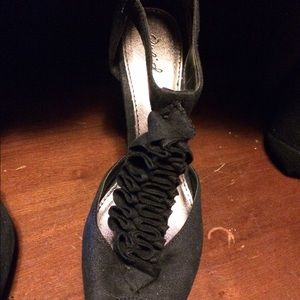 Gently worn black suede heels.