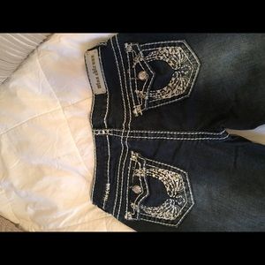 Dark blue jeans with white stitching and jewels!