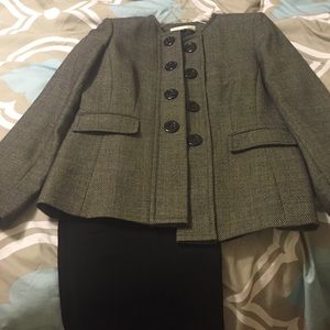 Black and white tweed suit.   Warn once.