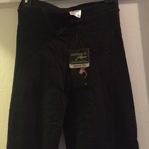 Danskins long pants. NWT. Small.