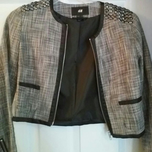 Zip up blazer jacket with studs on the shoulder.