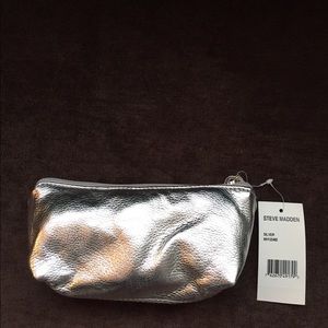 Steve Madden silver makeup bag.