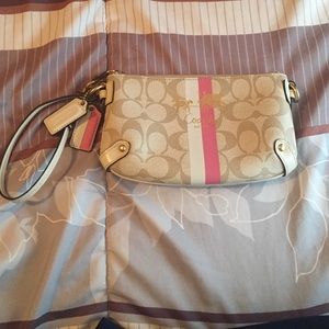 Cream colored leather authentic Coach Wristlet