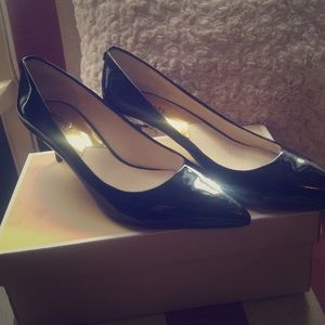 Size 11 patent leather Michael Kors heels.
