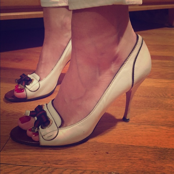 Gucci off white peep-toe heels.