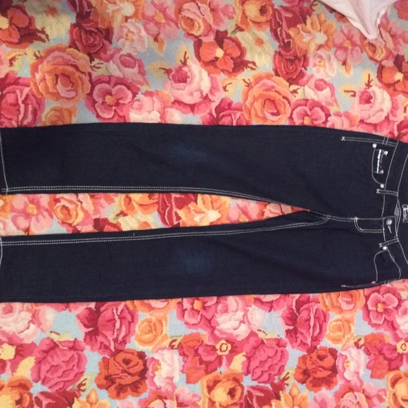 Dark blue jeans with fake diamonds.