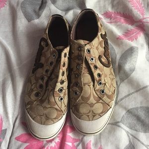 Brown coach slip ons