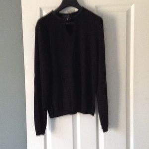 M. A.G. Sweater with leather neck trim.